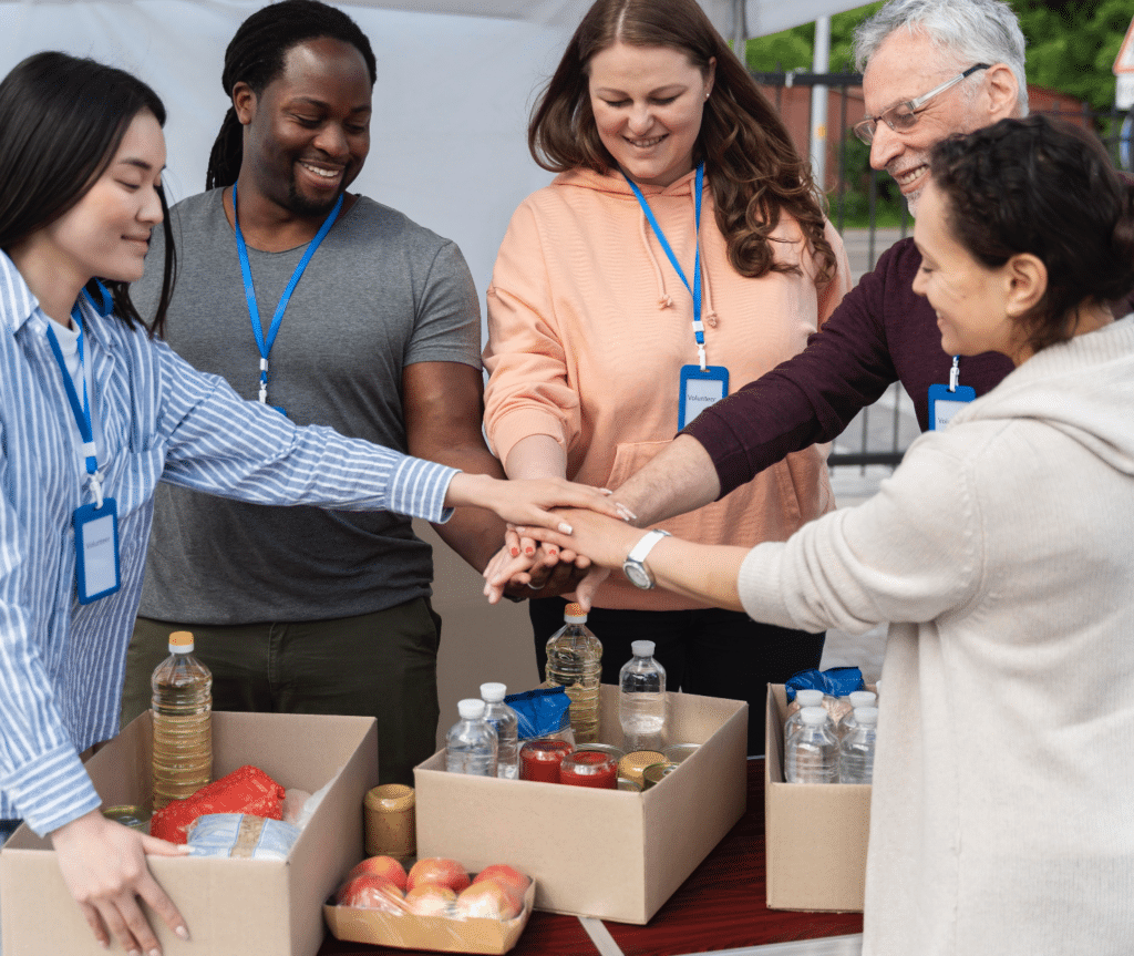 group of different people volunteering foodbank poor people